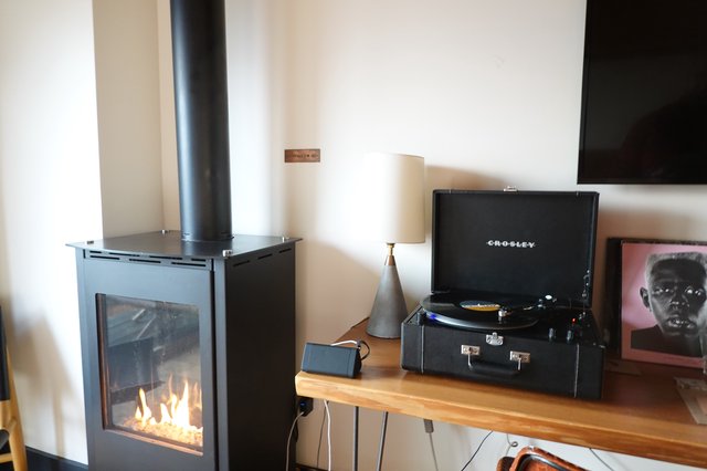 Cozy Living Room with Fireplace and Turntable
