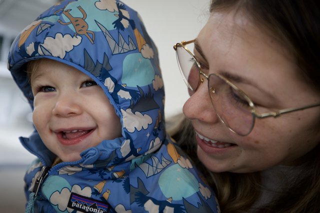 Joyful Winter Moment Between Mother and Child