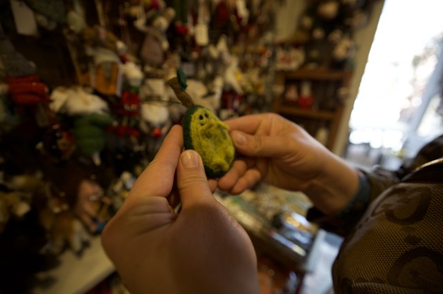 Examining a Jade Ghost Figure in Santa Fe Shop