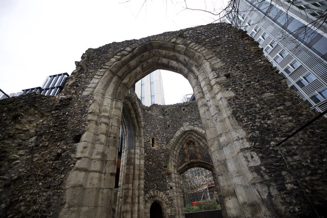Ancient Church Ruins Framed by Modern Architecture
