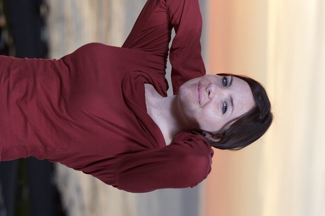 Woman in Crimson at Golden Hour Seaside