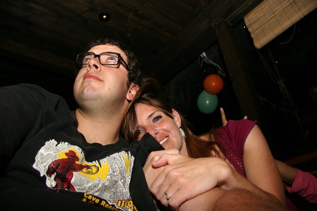 Couple Laughing Together at Late Night Party