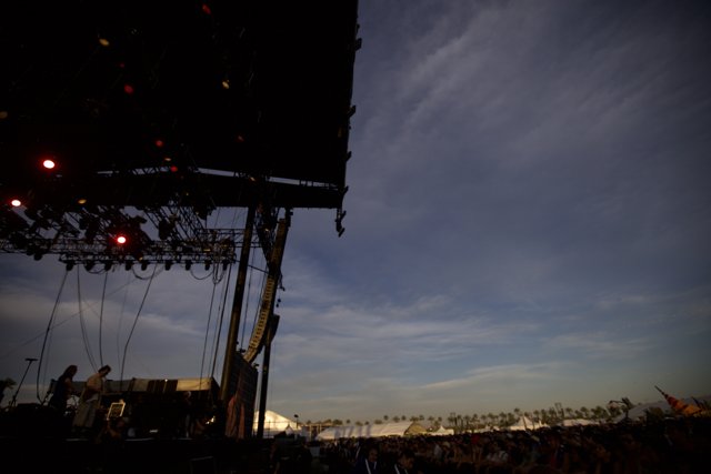 Stage Lights Illuminate Silhouetted Crowd at Coachella