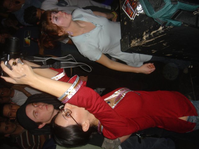 Red Shirted Woman in a City Club