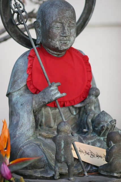 Buddha Statue with a Red Bib