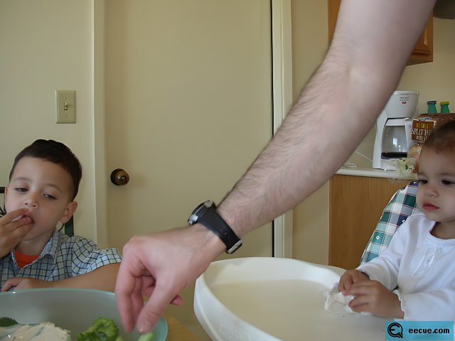 Father and Son Enjoying Mealtime