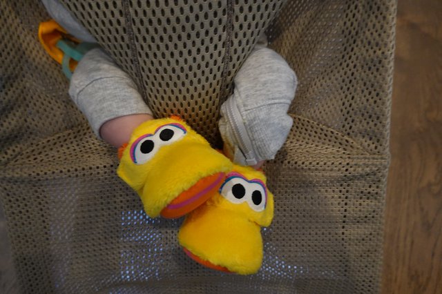 Child's Feet in Bright Yellow Character Slippers