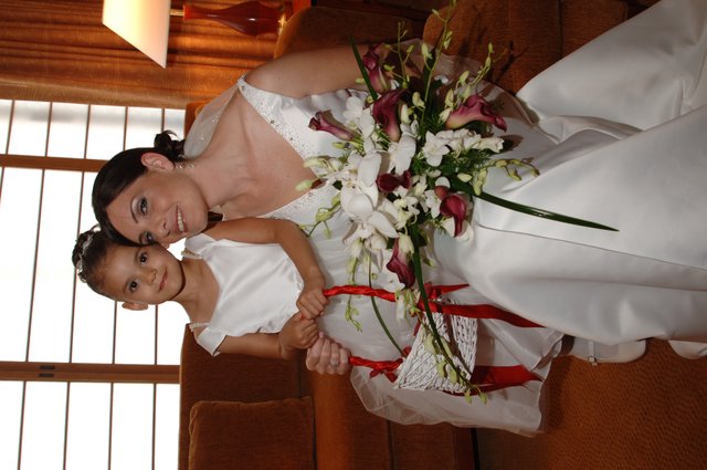 Bride and Flower Girl Share Tender Wedding Moment