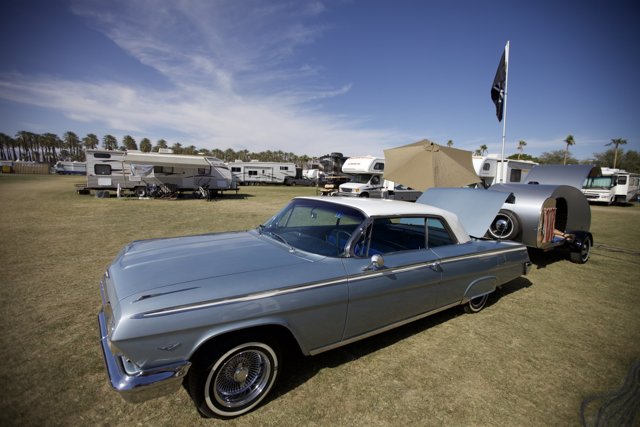 Vintage Car Rests Next to Trailer at Coachella