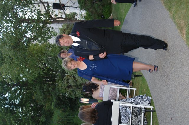 Elegant Couple Walking Down Wedding Aisle Outdoors