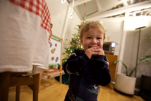 Toddler's Joyful Christmas Morning in Kitchen