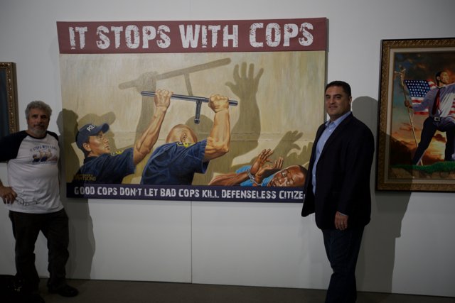 Obama and Uygur in front of Police Officer Painting