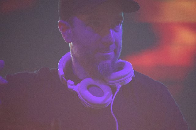 DJ Lost in Sound Under Purple Club Lights
