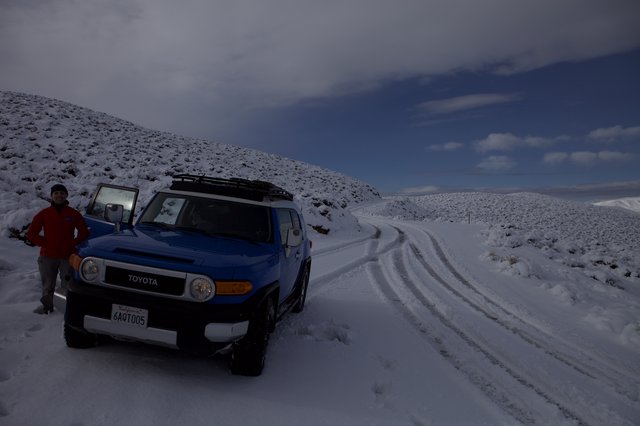 Blue Toyota FJ Cruiser on Snowy Mountain Road