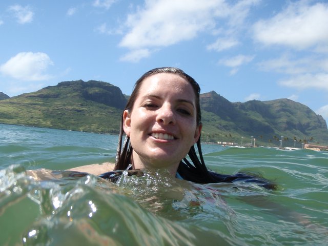 Smiling Woman Swimming in Hawaiian Ocean Waters