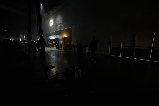 Full Haus Sign Glows Over Dark Concert Venue Floor