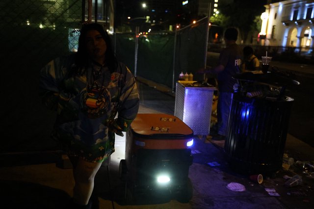 Autonomous Delivery Robot Navigates Nighttime Festival Sidewalk
