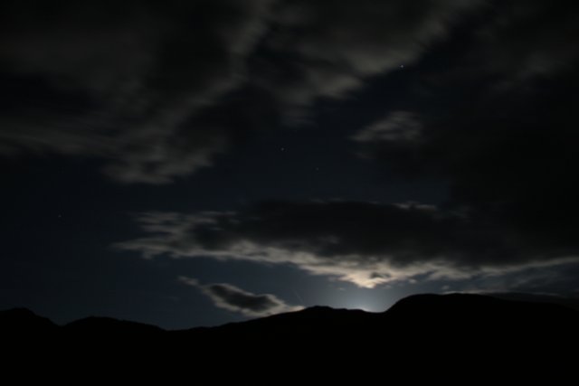 Moon and Clouds Over the Hill