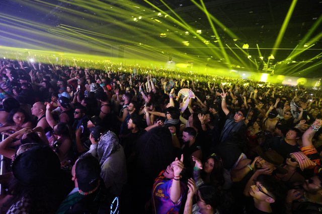 Massive EDM Crowd Surges Under Green Laser Light Show