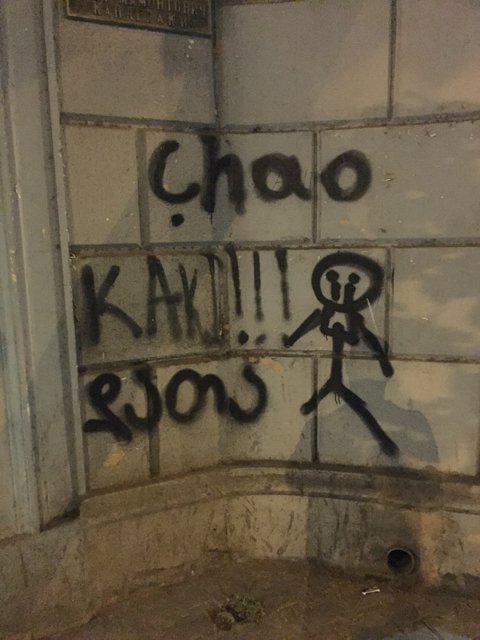 Cholo and Kara Graffiti on Building Wall