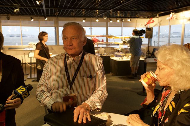 Buzz Aldrin Conversing with a Companion at a Restaurant
