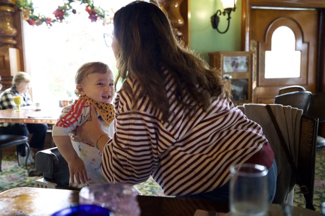 Mother and Child Share Joyful Moment at Restaurant