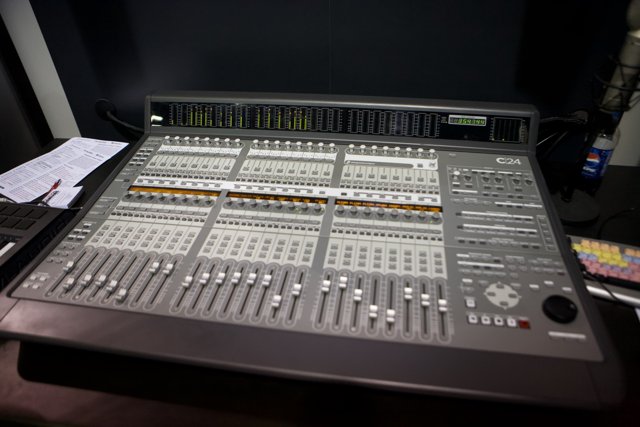 Studio Mixing Board with a Variety of Instruments