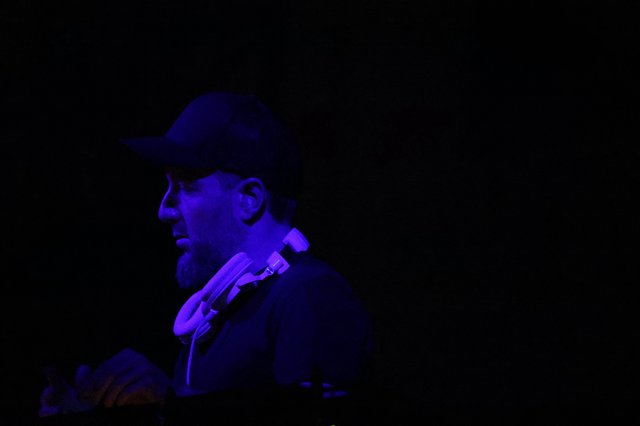 DJ Bathed in Blue UV Light at Wobbleland