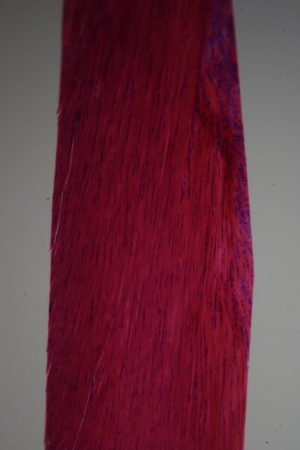 Velvet Tie on Red Textured Wood