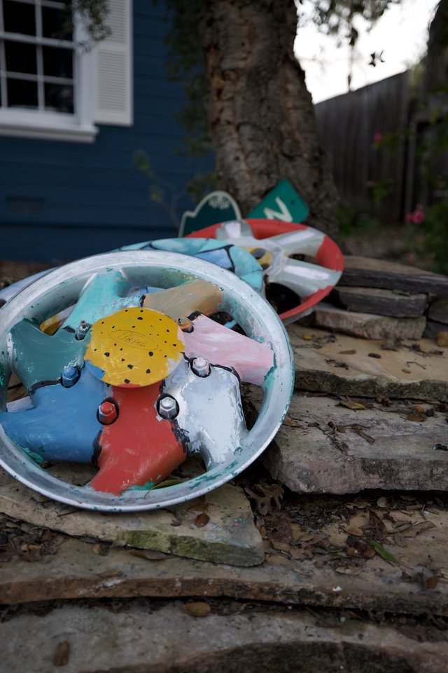 Broken Colorful Toy Clock in Backyard Garden