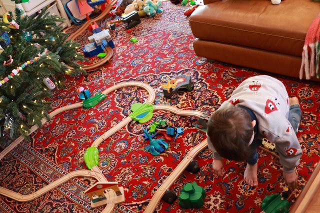 Child Playing with Train Set on Christmas Morning