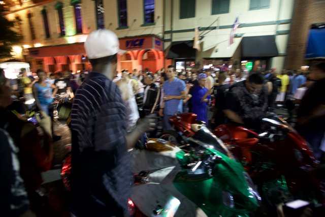 Motorcycle Rider Admires the Austin Crowd
