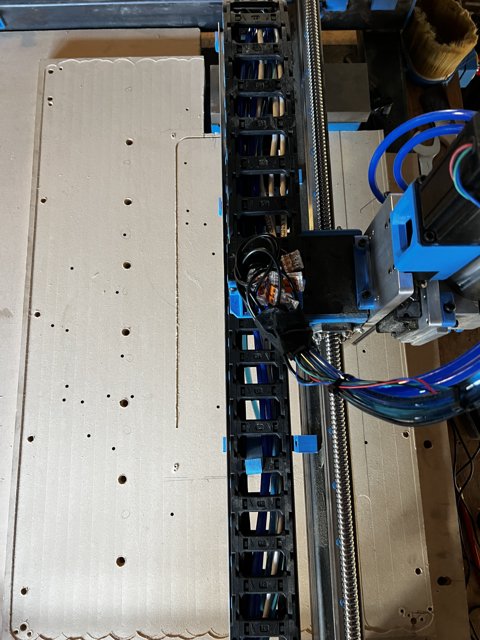 Automated machine working on a piece of cardboard