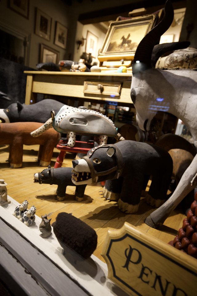 Handcrafted Folk Art Animal Collection on Wooden Display