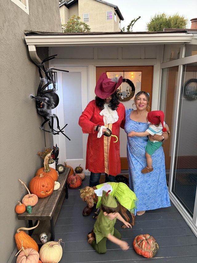 Family Peter Pan Halloween Costume on Decorated Porch