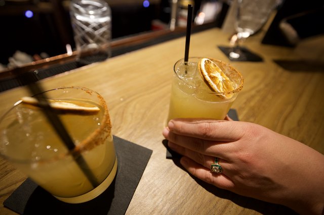 Margaritas with Dried Orange Garnish at Bar