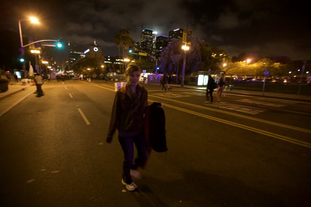 Night Walker on Empty Downtown Street at Dusk