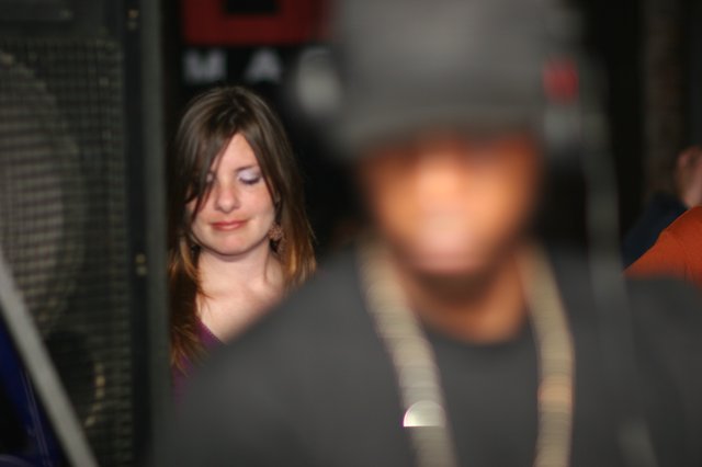 Smiling Woman at Nightclub Event in 2006