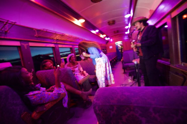 Live Music Performance on a Vibrant Train Car
