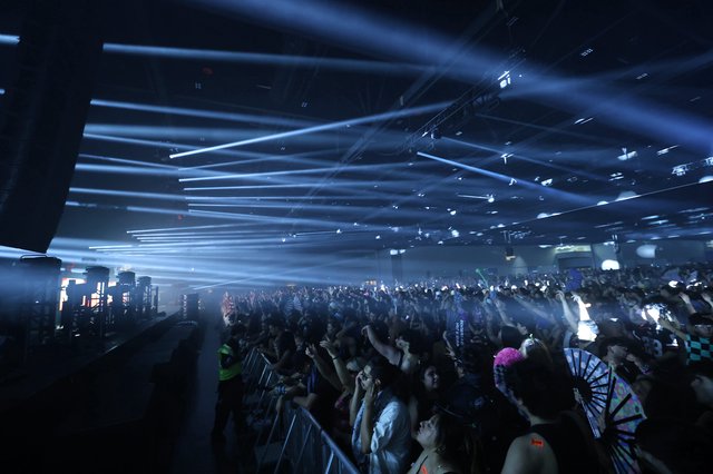 Massive Crowd Erupts Under Laser Light Storm