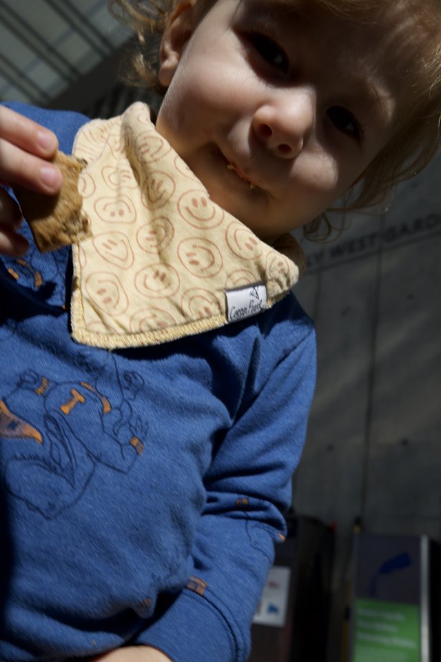 Child Proudly Displays Handmade Smiley Face Cloth