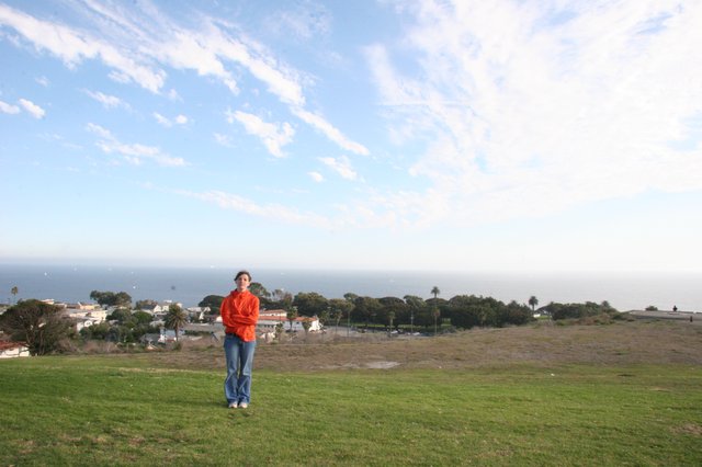 Woman in Red Jacket Overlooking Coastal California Town