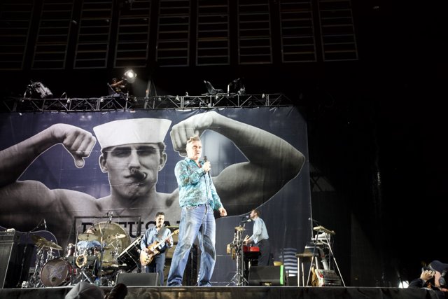 Morrissey and Rodrigo Corrales perform on stage