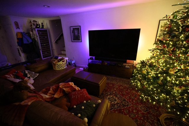 Cozy Christmas Living Room with Illuminated Tree and Ambient Lighting