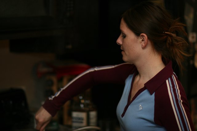 Woman in Retro Tracksuit at Casual Indoor Gathering