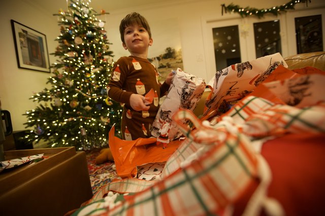 Christmas Morning Joy: Child Opening Presents