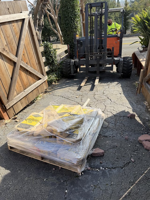 Forklift Delivering Building Materials to Residential Construction Site