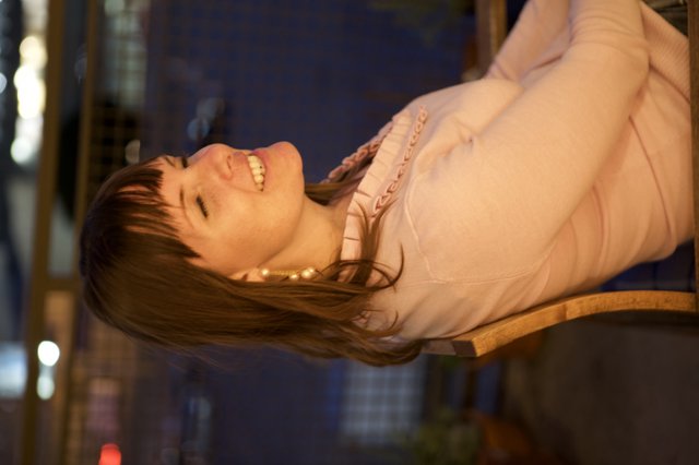 Joyful Woman Laughing in Warm Evening Light