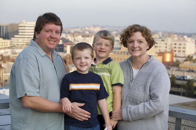 Family Portrait on Urban Rooftop at Dusk