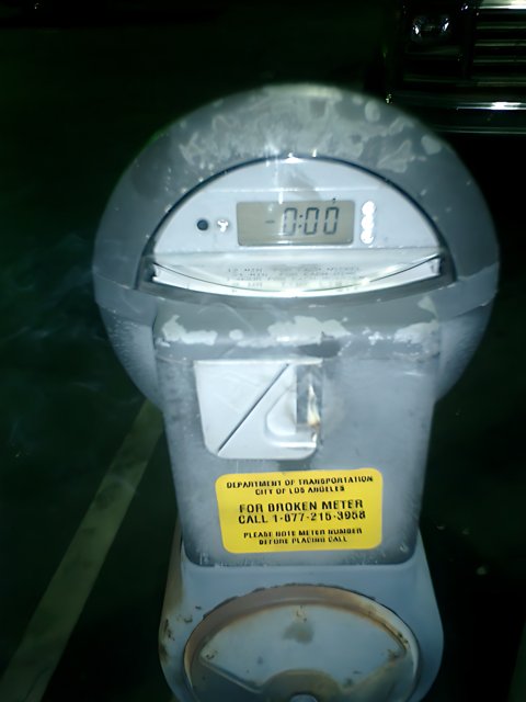 Parking Meter in a Busy Parking Lot